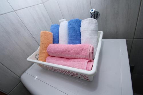 a rack of towels sitting on top of a toilet at Apartment Afrodita in Kaštela