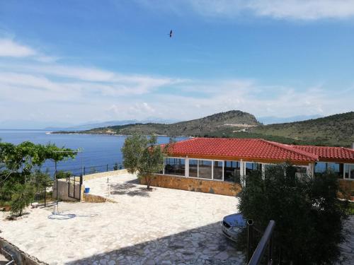 a house with a view of the water at Vila Bello in Ksamil