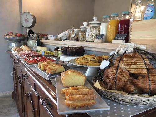 a buffet with many different types of food on a counter at Agriturismo Tra gli Ulivi, Chiappini Winery in Bolgheri