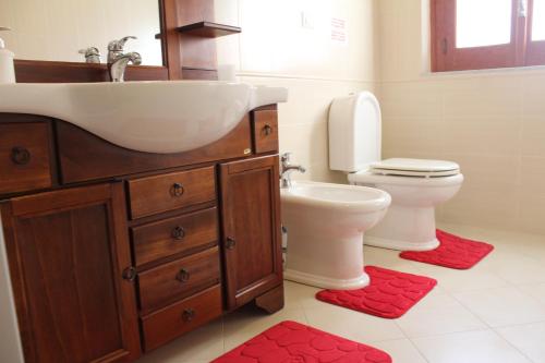 a bathroom with a sink and a toilet at B&B President Palace in Riposto