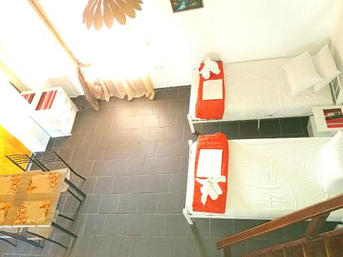 a room with three bunk beds on the wall at Pelagos Beachfront in Panormos Skopelos
