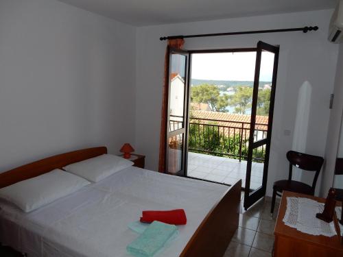Posteľ alebo postele v izbe v ubytovaní Apartments Indira II