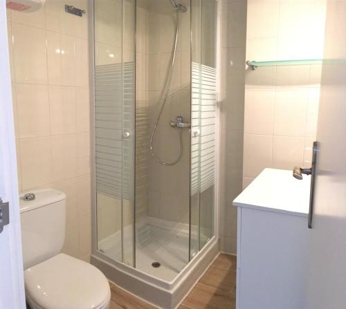 a bathroom with a shower with a toilet and a sink at Aiguaneu Sa Carbonera in Blanes