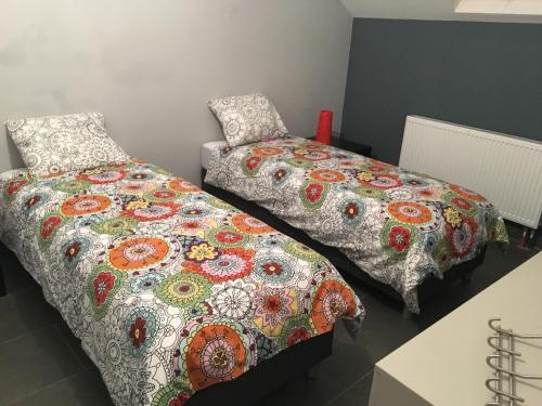 Katil atau katil-katil dalam bilik di Appartement Courcelles