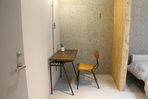 Ένα ή περισσότερα κρεβάτια σε δωμάτιο στο Guesthouse ushiyado