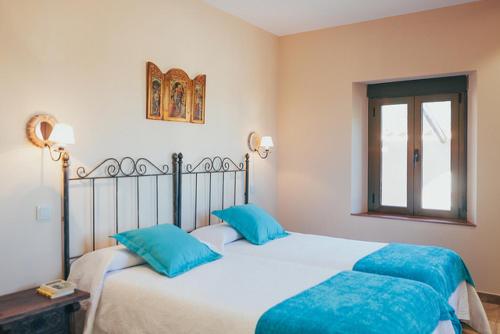Postel nebo postele na pokoji v ubytování La Aldea Colorada Casa Rural