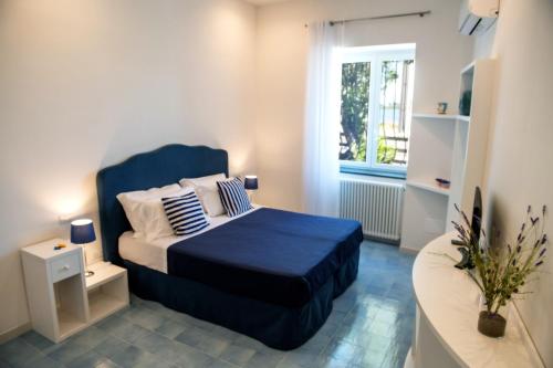 Postel nebo postele na pokoji v ubytování Domus Fortunae B&B