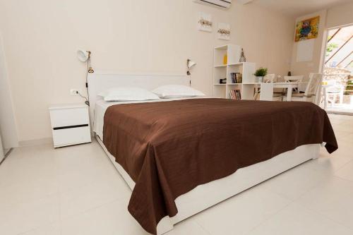 Postel nebo postele na pokoji v ubytování Studio Apartment Dada