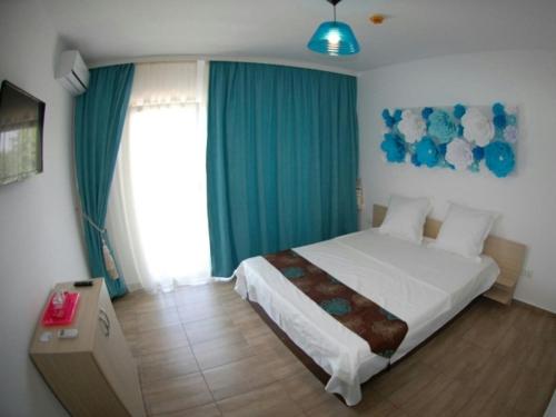 מיטה או מיטות בחדר ב-Vila Maria