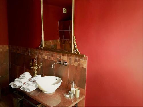 a bathroom with a sink and a mirror at Agriturismo Gocce di Luna in Celle Ligure