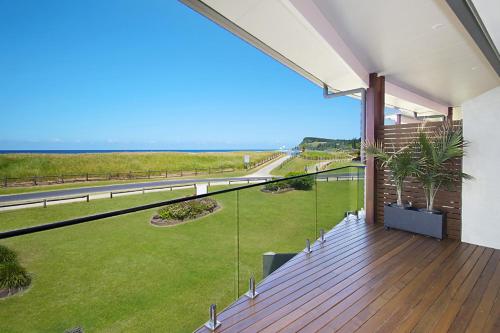 a balcony with a view of the ocean at Sunrise Reef 4 in Lennox Head