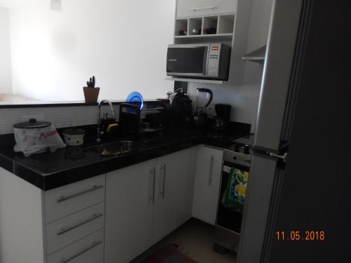 Dapur atau dapur kecil di Flat entre Mar e Lagoa