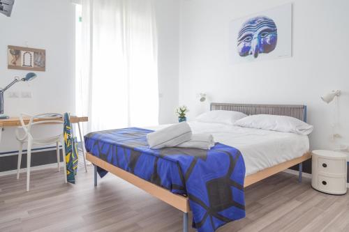Posteľ alebo postele v izbe v ubytovaní Nonna Pina Art Rooms