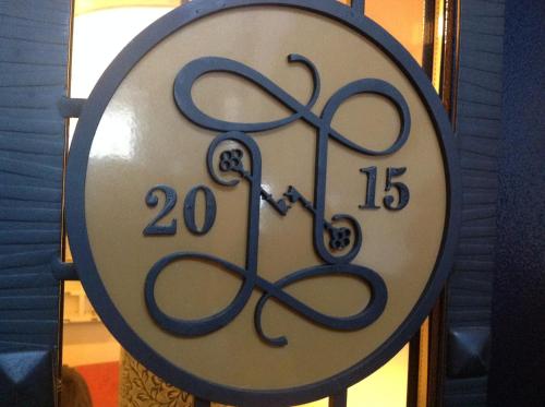 a clock with the numbers twenty fifteen on it at Apart-Hotel Naumov in Moscow