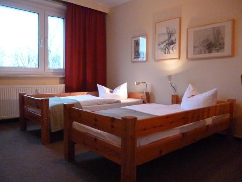 Ένα ή περισσότερα κρεβάτια σε δωμάτιο στο Hostel & Bistro Haus der Horizonte