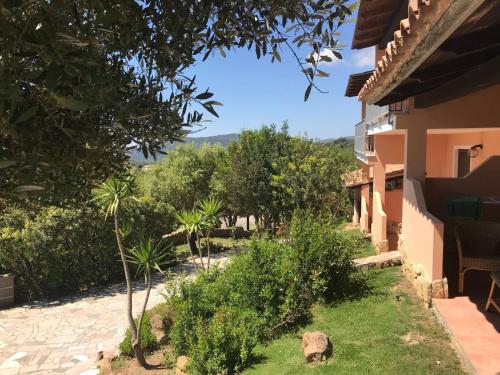 a view of the garden from the house at Hotel Belvedere in Teulada