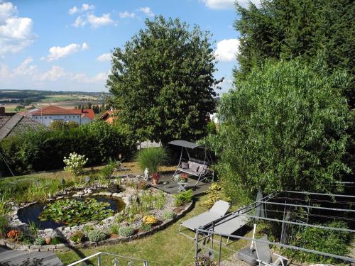 an overhead view of a garden with a pond at Ferienwohnung Schneider in Ormesheim