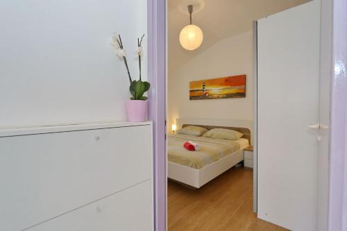 Ein Bett oder Betten in einem Zimmer der Unterkunft Apartment Dent