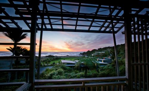 a view from a house with a view of the ocean at Scenic Hotel Punakaiki in Punakaiki
