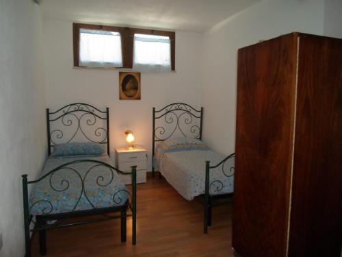 Säng eller sängar i ett rum på Villa Martina nel Salento