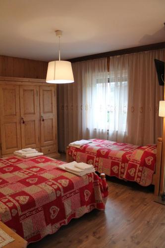Postel nebo postele na pokoji v ubytování B&B La Ceresara