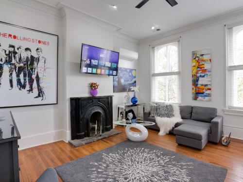 a living room with a couch and a fireplace at Downtown Memphis Shellcrest Apartments in Memphis