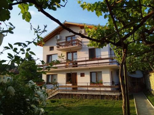 an external view of a house with trees at Guesthouse Argacho in Stob