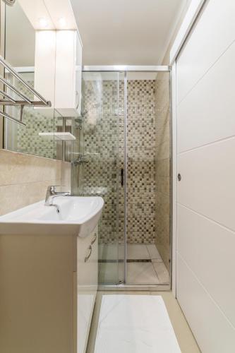 a bathroom with a shower and a sink at Studio Apartment Nikol in Split