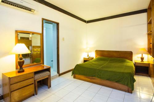 Katil atau katil-katil dalam bilik di Schweizer Hotel