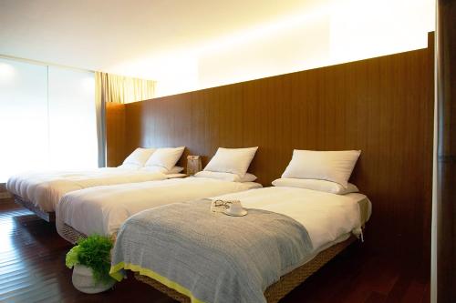 Letto o letti in una camera di Luminous Hot Spring Resort & SPA
