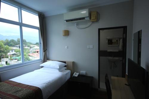 Una cama o camas en una habitación de Immana Grand Inle Hotel