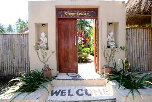 a door to a building with a welcome sign on it at Mama Bella's Retreat in Senggigi 