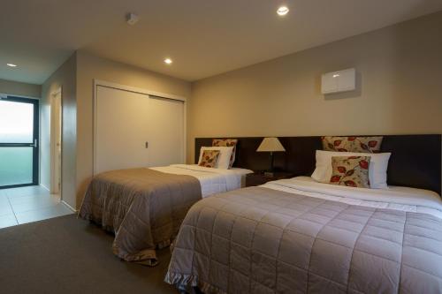 מיטה או מיטות בחדר ב-Apartments 118