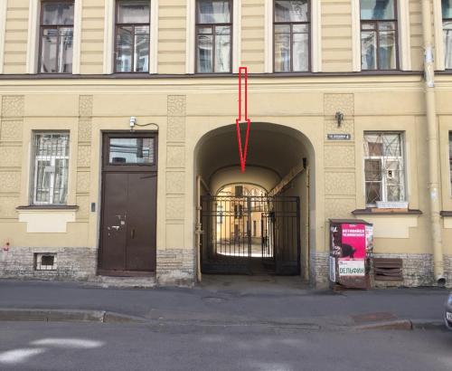 a building with a door with a red ribbon on it at Rinaldi at Petropavlovskaya in Saint Petersburg