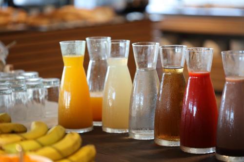 a group of different types of drinks on a table at Mar Azul Pur Estil Hotel & Spa - Adults only in Cala Ratjada