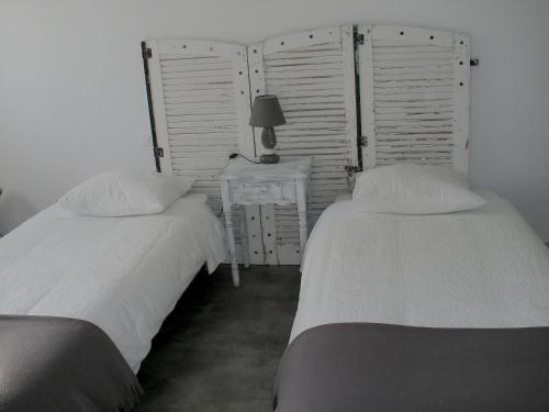 La Jumelière Laval Nordにあるベッド