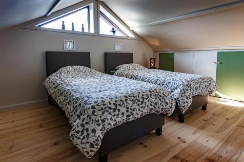Un pat sau paturi într-o cameră la Zente