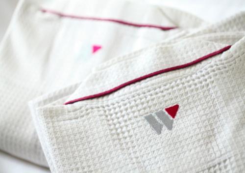 a close up of a white shirt with a red ribbon at Hotel Wing International Shonan Fujisawa in Fujisawa