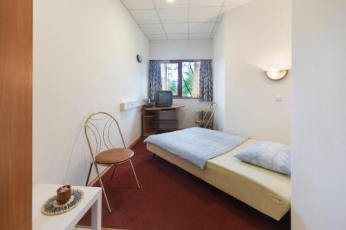 Una cama o camas en una habitación de Pension Union
