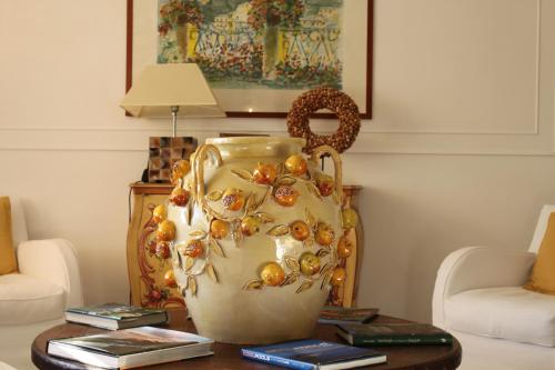 a vase sitting on a table in a living room at Hotel Helvetia in Sestri Levante