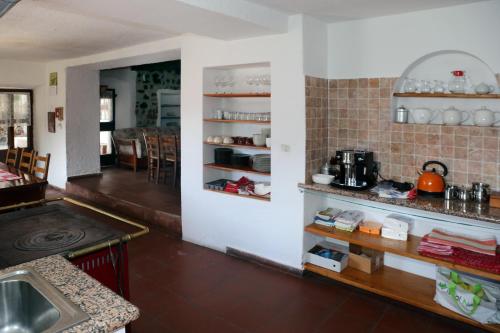a kitchen with a sink and a counter top at B&B Rocca di Bajedo in Pasturo