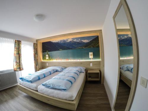 Postel nebo postele na pokoji v ubytování Hotel Posta