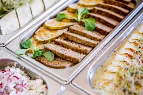 a tray of food with sandwiches and other foods at Dworek Pani Walewska in Gdańsk-Rębiechowo