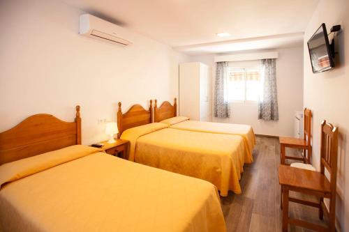Un pat sau paturi într-o cameră la Serramar