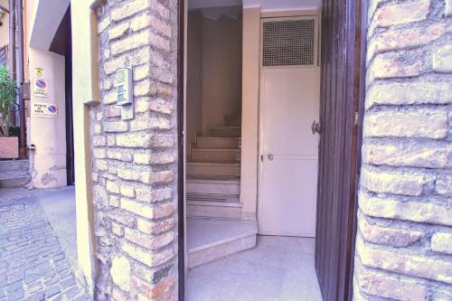 an open door to a house with a white door at La Briciola in Sirmione