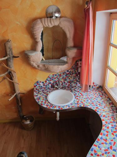 a bathroom with a sink in a room at Schiff Bihlerdorf - Hostel in Bihlerdorf