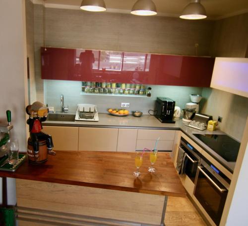 a kitchen with a counter with two glasses on it at bibou's room Paris in Les Lilas