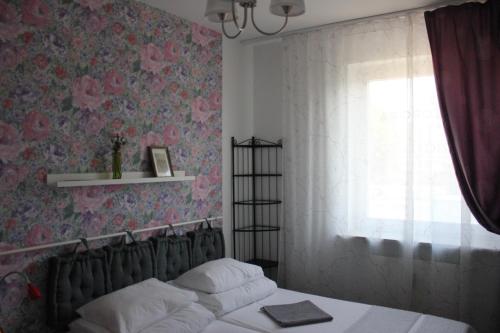 Ένα ή περισσότερα κρεβάτια σε δωμάτιο στο Kolorowa Guest Rooms