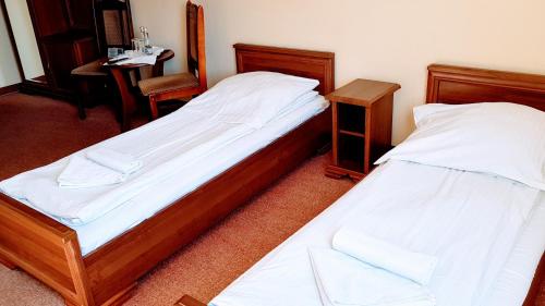 Un ou plusieurs lits dans un hébergement de l'établissement Kania Pokoje Gościnne