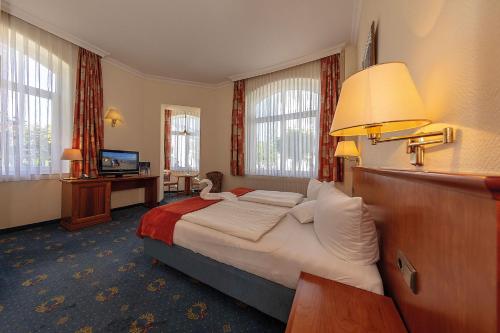 Postel nebo postele na pokoji v ubytování Hotel Deutsche Flagge